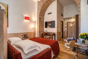 TV a/nebo společenská místnost v ubytování Kolbe Hotel Rome