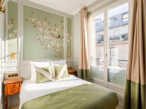 Posteľ alebo postele v izbe v ubytovaní Merveil - Luxury Suite - Louvre - Opera II