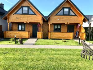 Vonkajšia záhrada v ubytovaní Delfinek - Domki Apartamenty