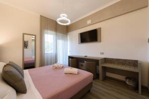 Postel nebo postele na pokoji v ubytování Hotel Casa Tra Noi + 37 fotografií