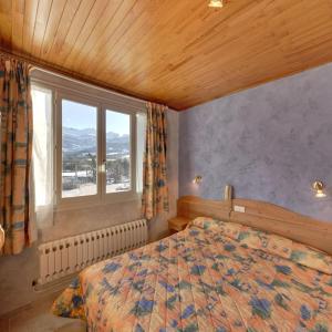 מיטה או מיטות בחדר ב-Le Sans Souci