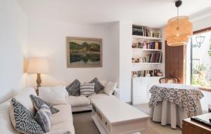 a living room with a couch and a table at Villa Cabrera in Colonia Sant Jordi