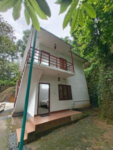 a rendering of a house with a balcony at Sunleo Villas in Anachal