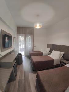 Postel nebo postele na pokoji v ubytování Hotel Casa Tra Noi