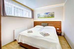 Postel nebo postele na pokoji v ubytování Appartement Alpensee