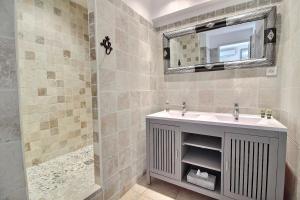 a bathroom with a sink and a shower at B&B Villa Ganesh in Le Rouret +43 photos