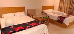 Postel nebo postele na pokoji v ubytování Hotel Dhanmondi Residential + 26 fotografií