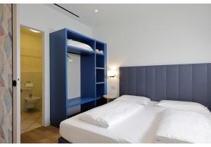 Postel nebo postele na pokoji v ubytování Hotel Residence Zust