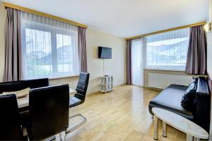 TV a/nebo společenská místnost v ubytování Appartement Alpensee