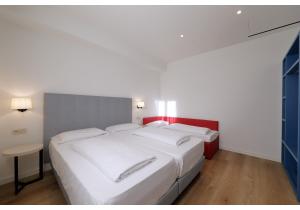 Postel nebo postele na pokoji v ubytování Hotel Residence Zust