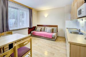 Kuchyň nebo kuchyňský kout v ubytování Appartement Alpensee