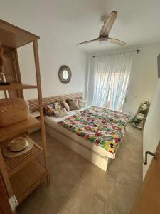 a bedroom with a bed and a ceiling fan at La casa Latina in Vinarós +56 photos