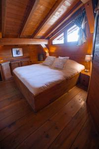 Postel nebo postele na pokoji v ubytování Chalet "Montblanc" Les Greniers du MontBlanc