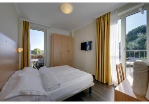 Postel nebo postele na pokoji v ubytování Hotel Residence Zust