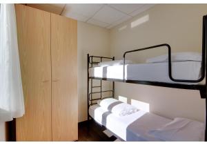 Postel nebo postele na pokoji v ubytování Hotel Residence Zust