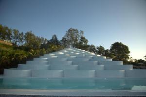 a stairway to the sky at a building at Cinze Villas and Hot Spring in Kubupenlokan +23 photos