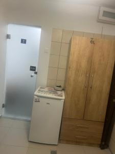 A kitchen or kitchenette at Centrally Located Private Rooms Még 21 kép
