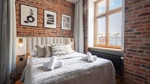 Postel nebo postele na pokoji v ubytování Aparthotel Delta Boutique