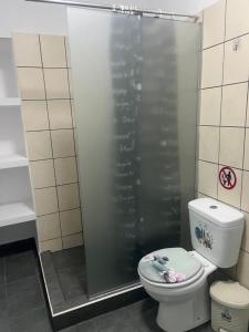 a bathroom with a shower with a toilet at Centrally Located Private Rooms in Heraklio Town