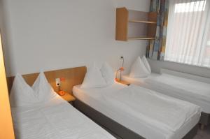 Llit o llits en una habitació de Kolpinghaus Linz