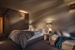 A bed or beds in a room at Brenta Dolomites