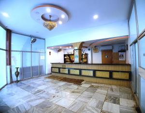 Postel nebo postele na pokoji v ubytování Hotel Sea Coast