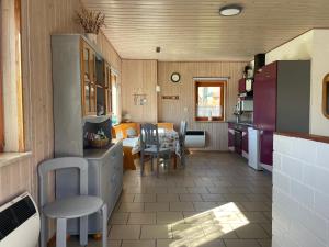 a kitchen with a table and a dining room at Ostseebauernhof Schönhagen in Brodersby