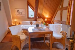 a living room with a couch and a table at Theeshof in Soltau