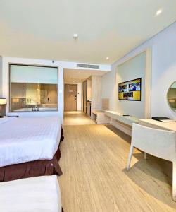 Postel nebo postele na pokoji v ubytování DQua Hotel