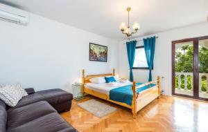 a bedroom with a bed and a couch at Vila Iris - Opatija by Villas Guide in Breza +45 photos