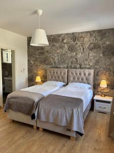 Ένα ή περισσότερα κρεβάτια σε δωμάτιο στο Villa Stancija Kavali stone house, Zvoneća-Opatija