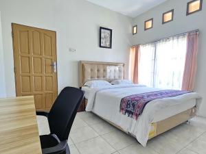 Postel nebo postele na pokoji v ubytování Flamboyan House + 2 fotografie