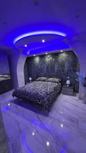 a bed in a room with a purple ceiling at Testa House 2 0 in Catania +28 photos