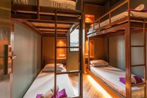 a bunk bed room with two bunk beds in it at Loftel 22 Hostel in Bangkok +81 photos