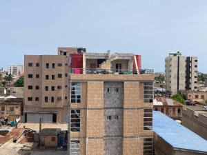 a building under construction on top of a city at Hôtel YABISSO in Lomé