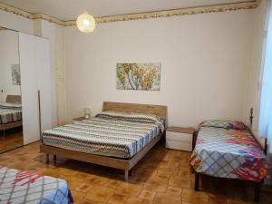 Postel nebo postele na pokoji v ubytování Bilo Cisaria