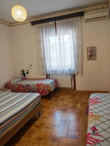 Postel nebo postele na pokoji v ubytování Bilo Cisaria