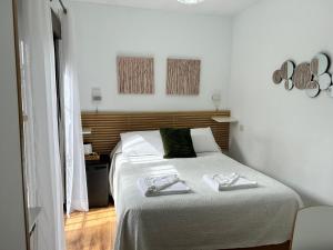 Postel nebo postele na pokoji v ubytování El Mondalindo Habitación intima con patio