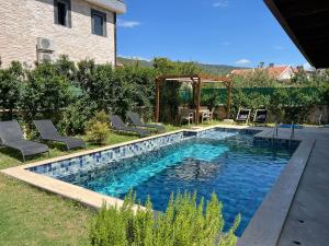 Πισίνα στο ή κοντά στο Derya Beach Agullu Villa 4