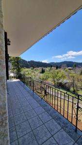 a balcony with a view of the desert at Tsigaridas Mountain Home in Neokhórion