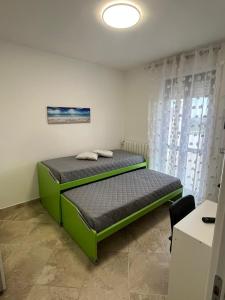 Postel nebo postele na pokoji v ubytování DDN House