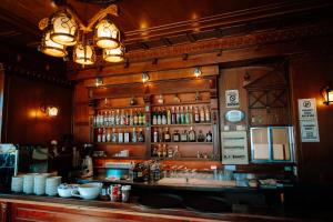 a bar with a lot of bottles of alcohol at Hotel Delta in Durrës