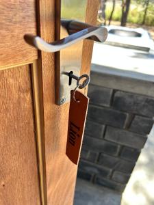 a lock on a door with a tag on it at Northern Rock Campsites in Otjiwarongo +18 photos