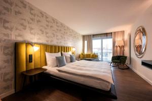 Wellnesshotel Wittelsbach客房内的一张或多张床位