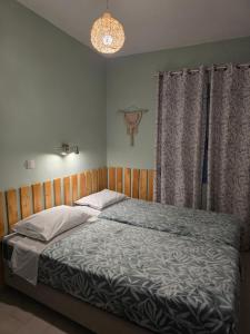 Posteľ alebo postele v izbe v ubytovaní Voula's House
