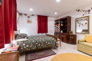 a bedroom with a bed and a couch at Nonna Lina in Castel di Ieri