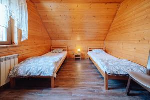 Posteľ alebo postele v izbe v ubytovaní Domek Karkonosze