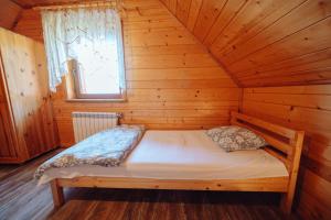Posteľ alebo postele v izbe v ubytovaní Domek Karkonosze