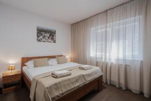 Postel nebo postele na pokoji v ubytování Residence Malva