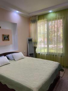Postel nebo postele na pokoji v ubytování Laguna City Family Cottages in Issyk-Kyl